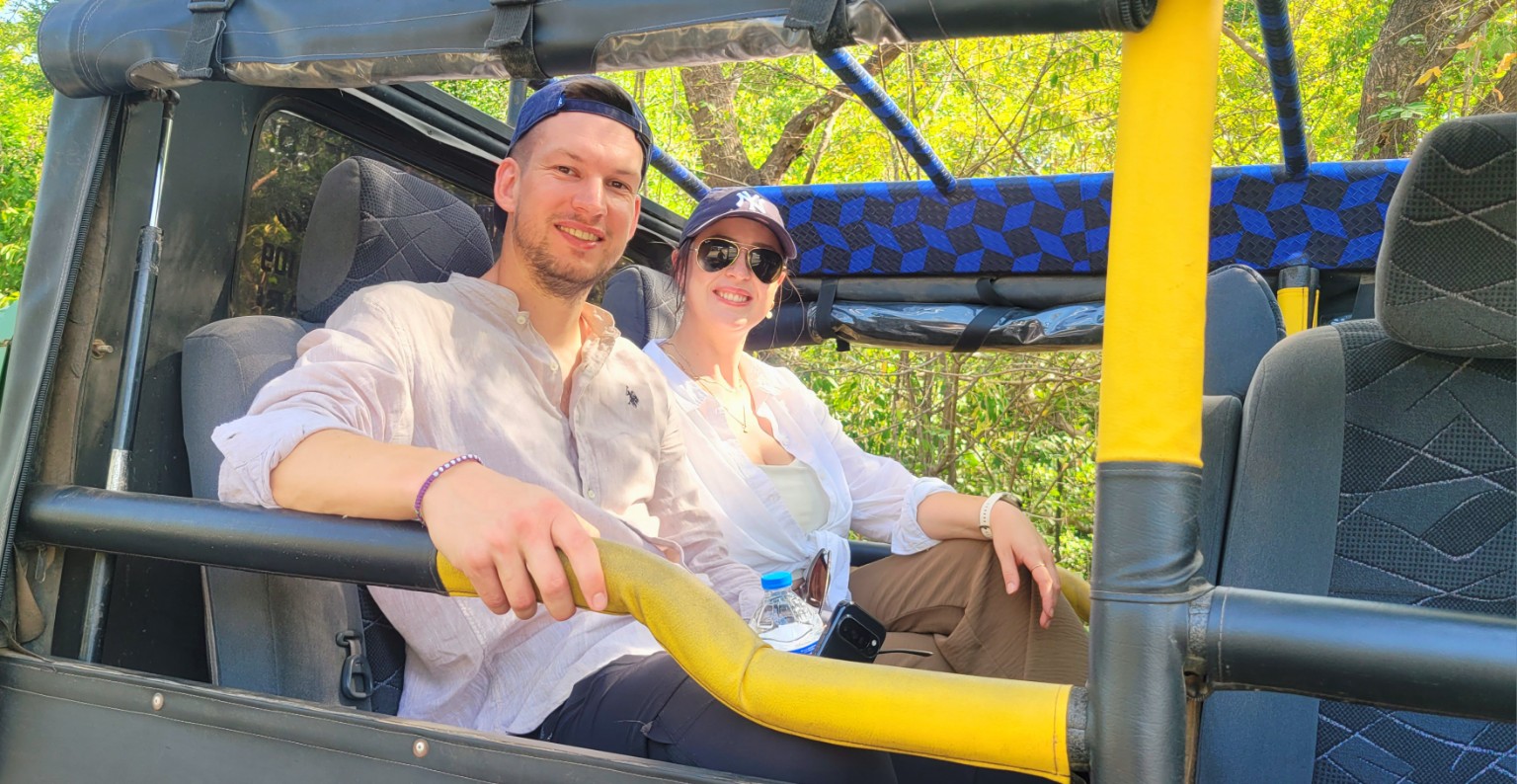 Couple enjoying a safari jeep ride